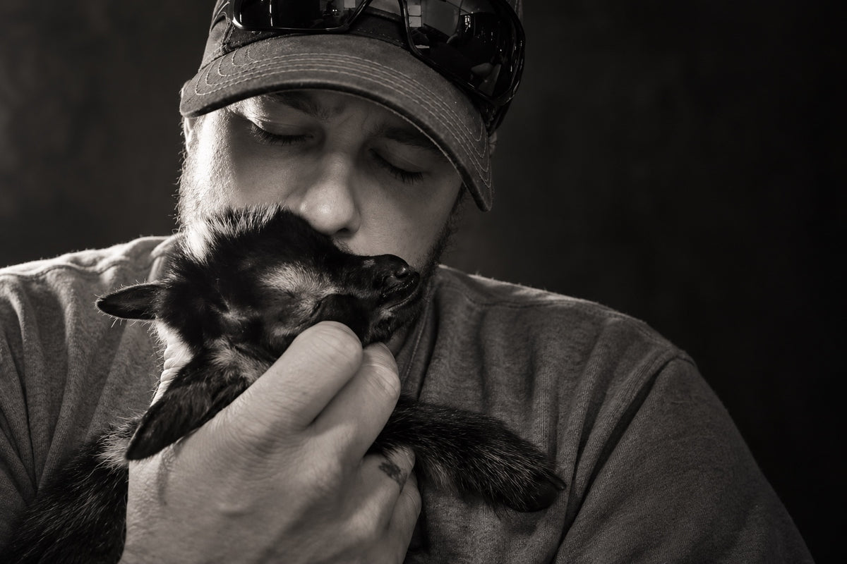 Justin holding baby Hope close in a black-and-white portrait