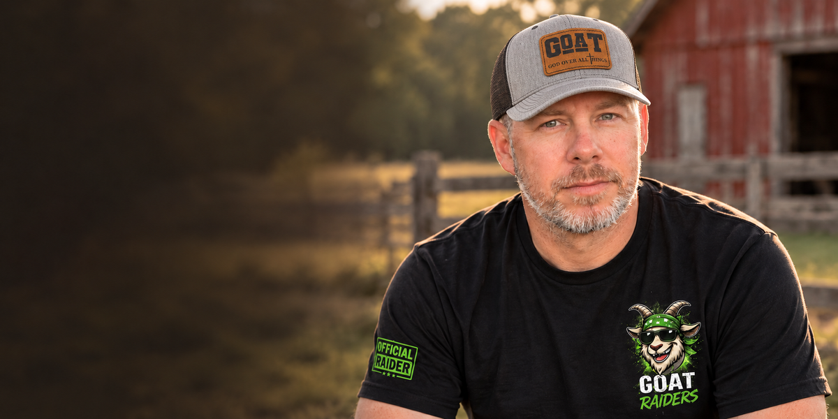 The Goatfather wearing a God Over All Things hat